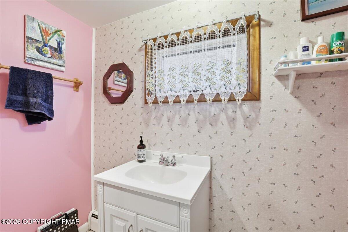 2487 Mountain Road Stroudsburg, PA 18360 - Photo 20 of 61 a bathroom with a sink mirror and vanity