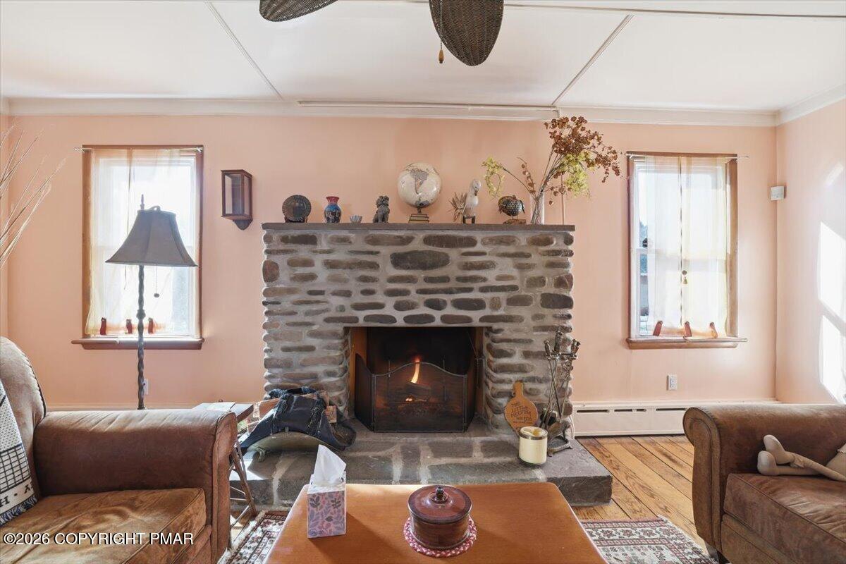 2487 Mountain Road Stroudsburg, PA 18360 - Photo 24 of 61 a living room with furniture and a fireplace