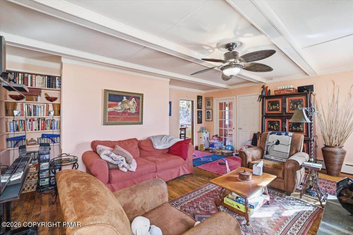 2487 Mountain Road Stroudsburg, PA 18360 - Photo 25 of 61 a living room with furniture a bookshelf and a window