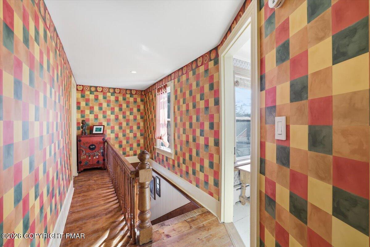 2487 Mountain Road Stroudsburg, PA 18360 - Photo 27 of 61 a view of a balcony with wooden floor and stairs