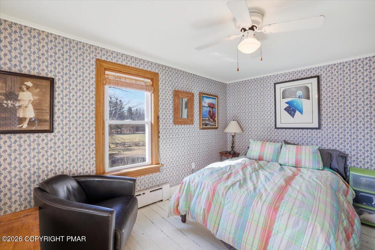 2487 Mountain Road Stroudsburg, PA 18360 - Photo 29 of 61 a bedroom with a bed and a couch