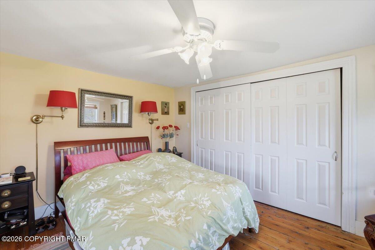2487 Mountain Road Stroudsburg, PA 18360 - Photo 36 of 61 a bed sitting in a bedroom next to a window