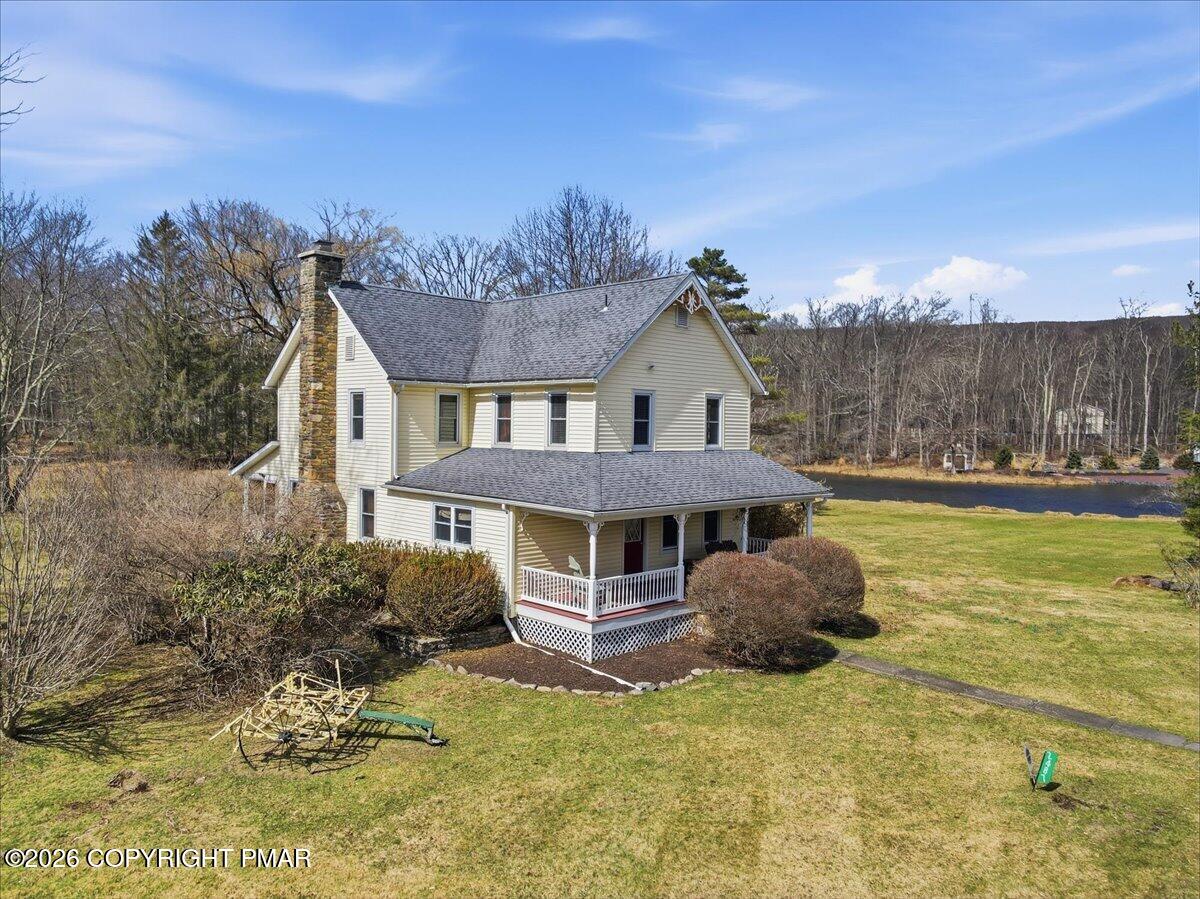 2487 Mountain Road Stroudsburg, PA 18360 - Photo 47 of 61 a view of a house with pool and a yard