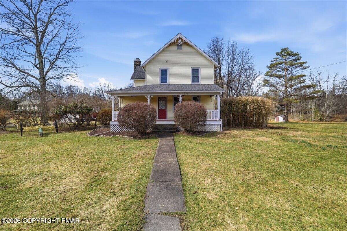 2487 Mountain Road Stroudsburg, PA 18360 - Photo 48 of 61 a front view of a house with a garden