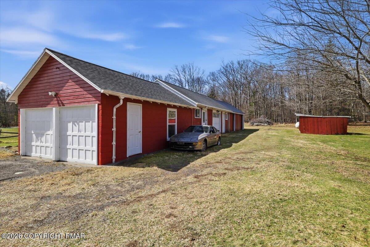 2487 Mountain Road Stroudsburg, PA 18360 - Photo 50 of 61 a front view of a house with a yard