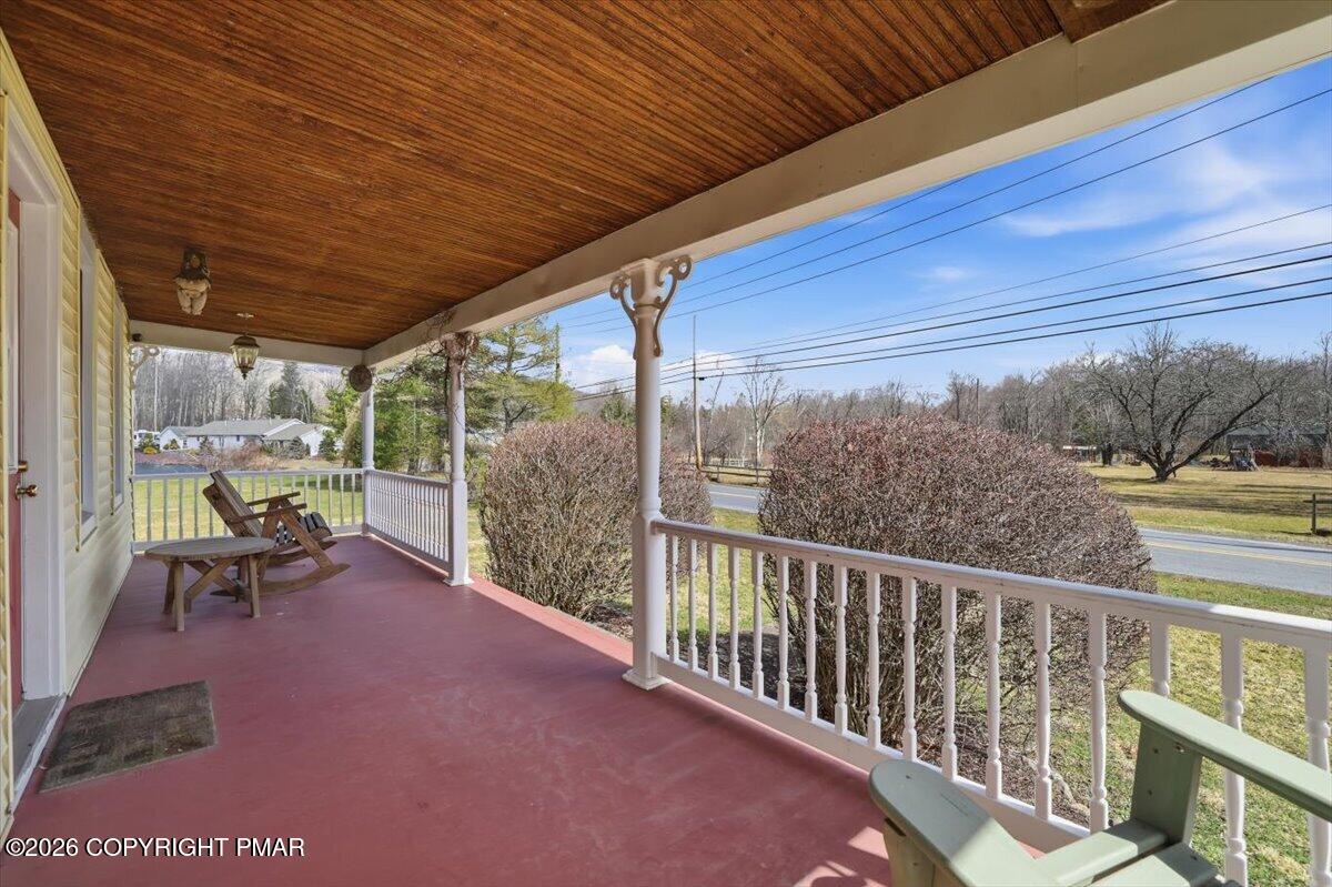 2487 Mountain Road Stroudsburg, PA 18360 - Photo 5 of 61 a view of two chairs in the balcony