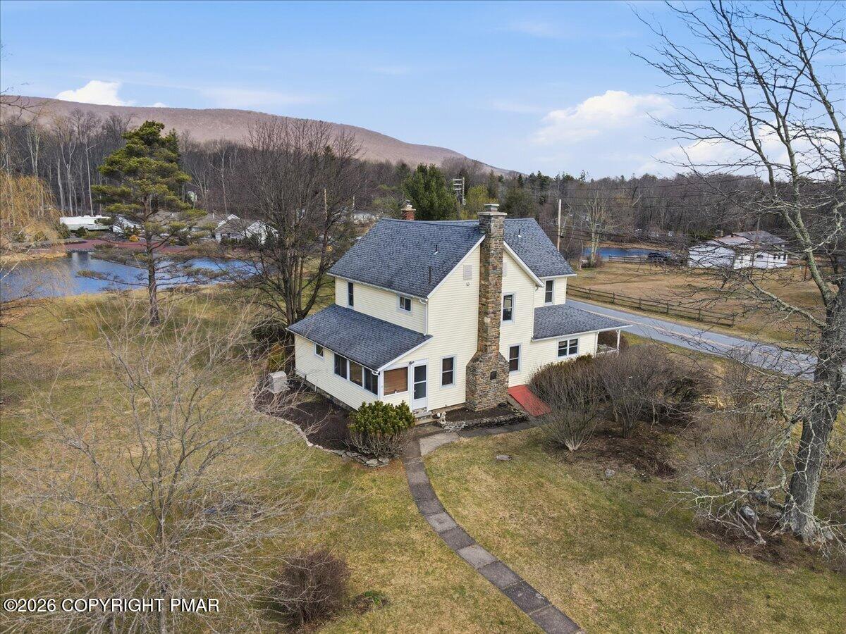 2487 Mountain Road Stroudsburg, PA 18360 - Photo 56 of 61 a aerial view of a house with a yard and mountain view
