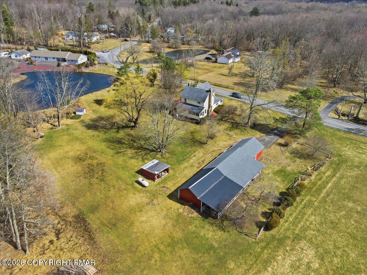 2487 Mountain Road Stroudsburg, PA 18360 - Photo 60 of 61 a view of swimming pool with lawn chairs and plants