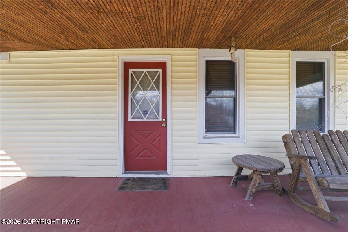 2487 Mountain Road Stroudsburg, PA 18360 - Photo 6 of 61 a backyard of a house with table and chairs