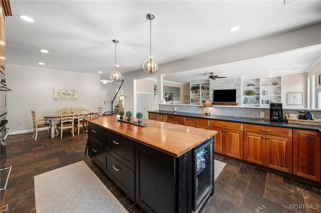 4060 Foxrun Road Powhatan, VA 23139 - Photo 12 of 50 a kitchen with kitchen island granite countertop a sink a counter top space and stainless steel appliances
