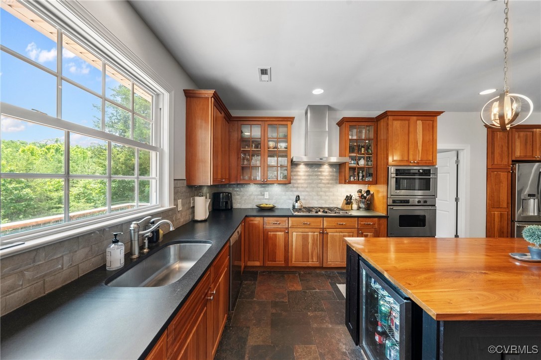 4060 Foxrun Road Powhatan, VA 23139 - Photo 13 of 50 a kitchen with stainless steel appliances granite countertop a sink a stove and a refrigerator