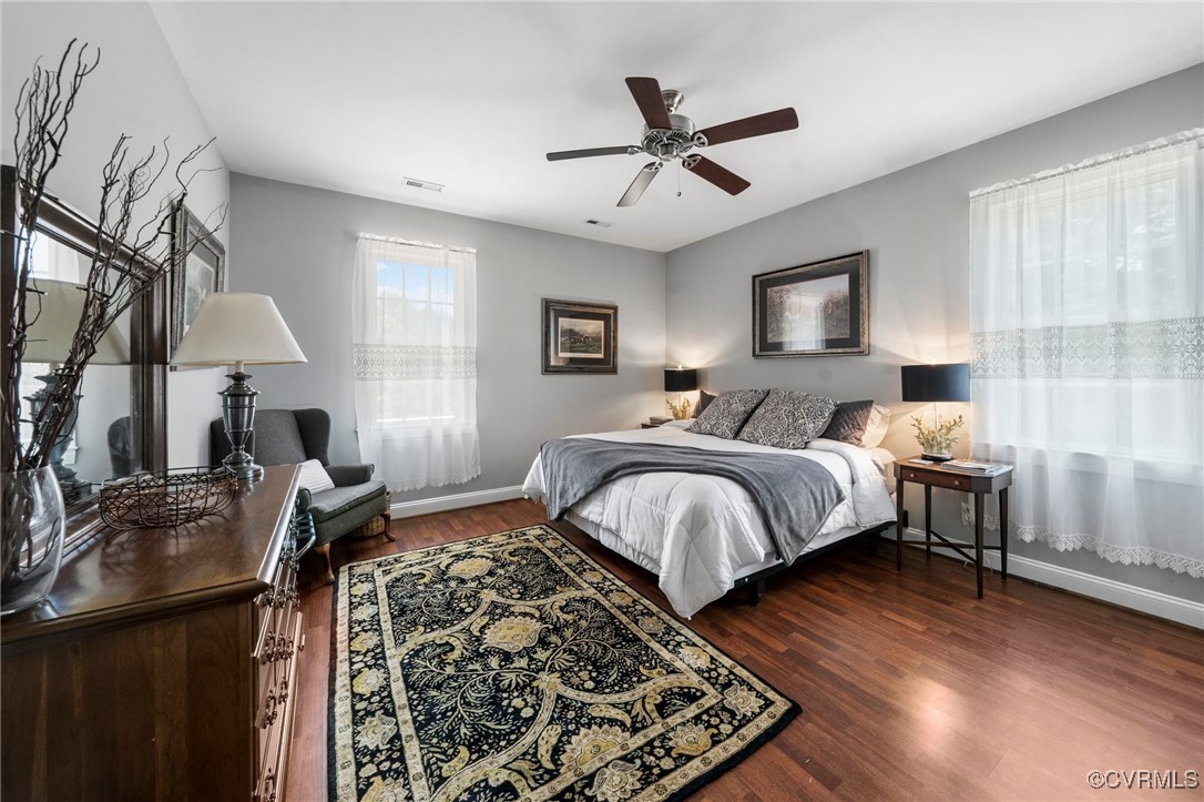 4060 Foxrun Road Powhatan, VA 23139 - Photo 19 of 50 a bedroom with a bed and wooden floor