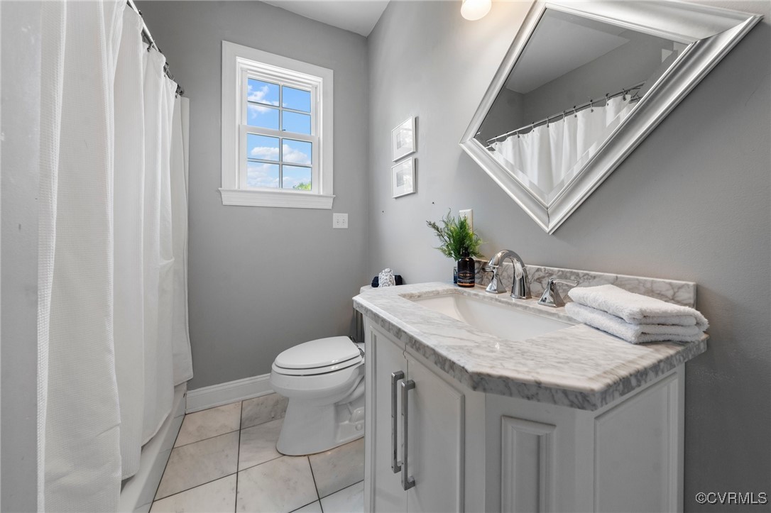 4060 Foxrun Road Powhatan, VA 23139 - Photo 20 of 50 a bathroom with a granite countertop sink and a toilet