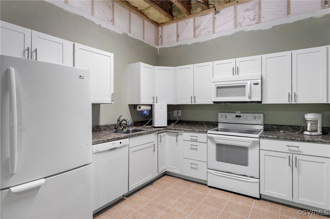 4060 Foxrun Road Powhatan, VA 23139 - Photo 26 of 50 a kitchen with white cabinets appliances and a sink
