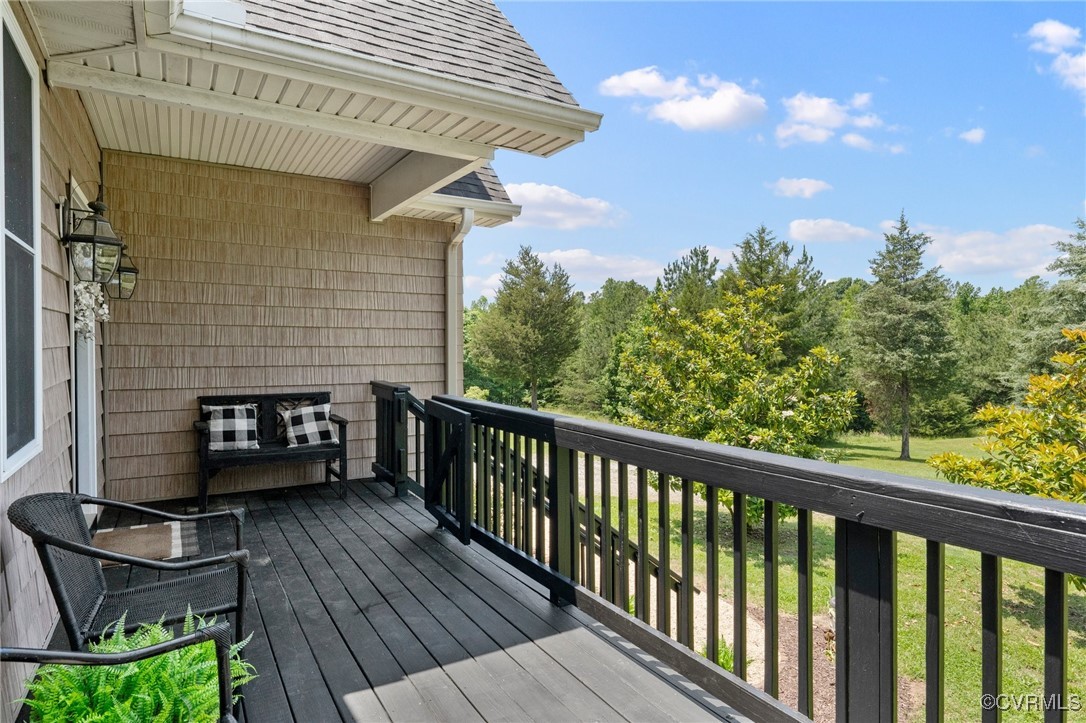 4060 Foxrun Road Powhatan, VA 23139 - Photo 3 of 50 a balcony with a table and chairs