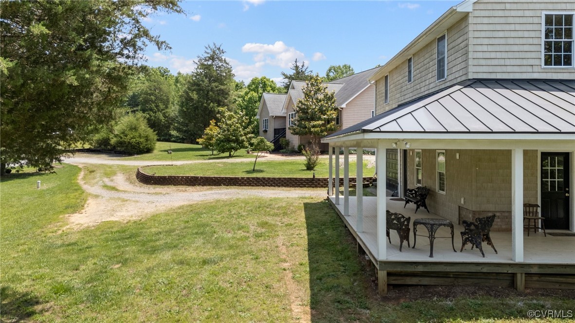 4060 Foxrun Road Powhatan, VA 23139 - Photo 34 of 50 a view of a house with backyard and sitting area