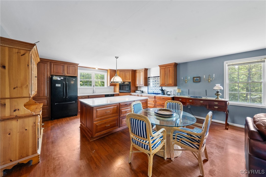 4060 Foxrun Road Powhatan, VA 23139 - Photo 39 of 50 a kitchen with stainless steel appliances kitchen island granite countertop a dining table chairs and a refrigerator