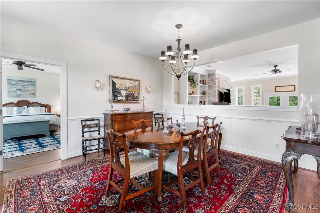 4060 Foxrun Road Powhatan, VA 23139 - Photo 7 of 50 a view of a dining room with furniture and wooden floor
