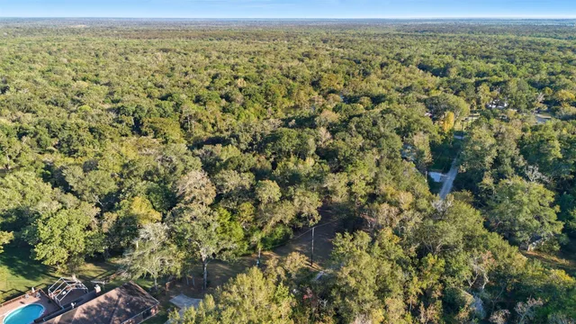 a view of a room with furniture and chandelier