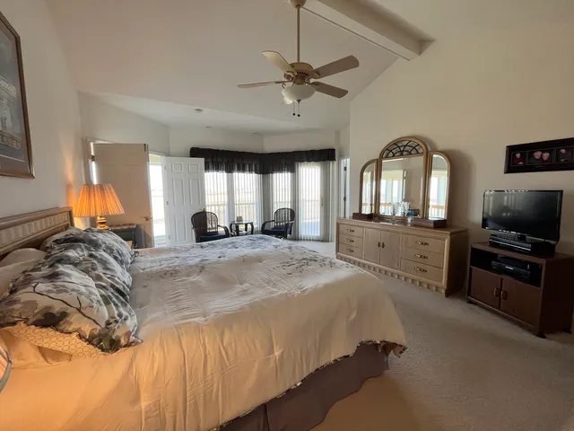 a bed room with a bed and a television