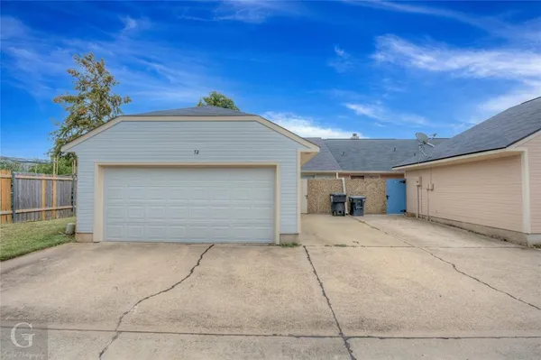 a view of a house with a garage and a garage