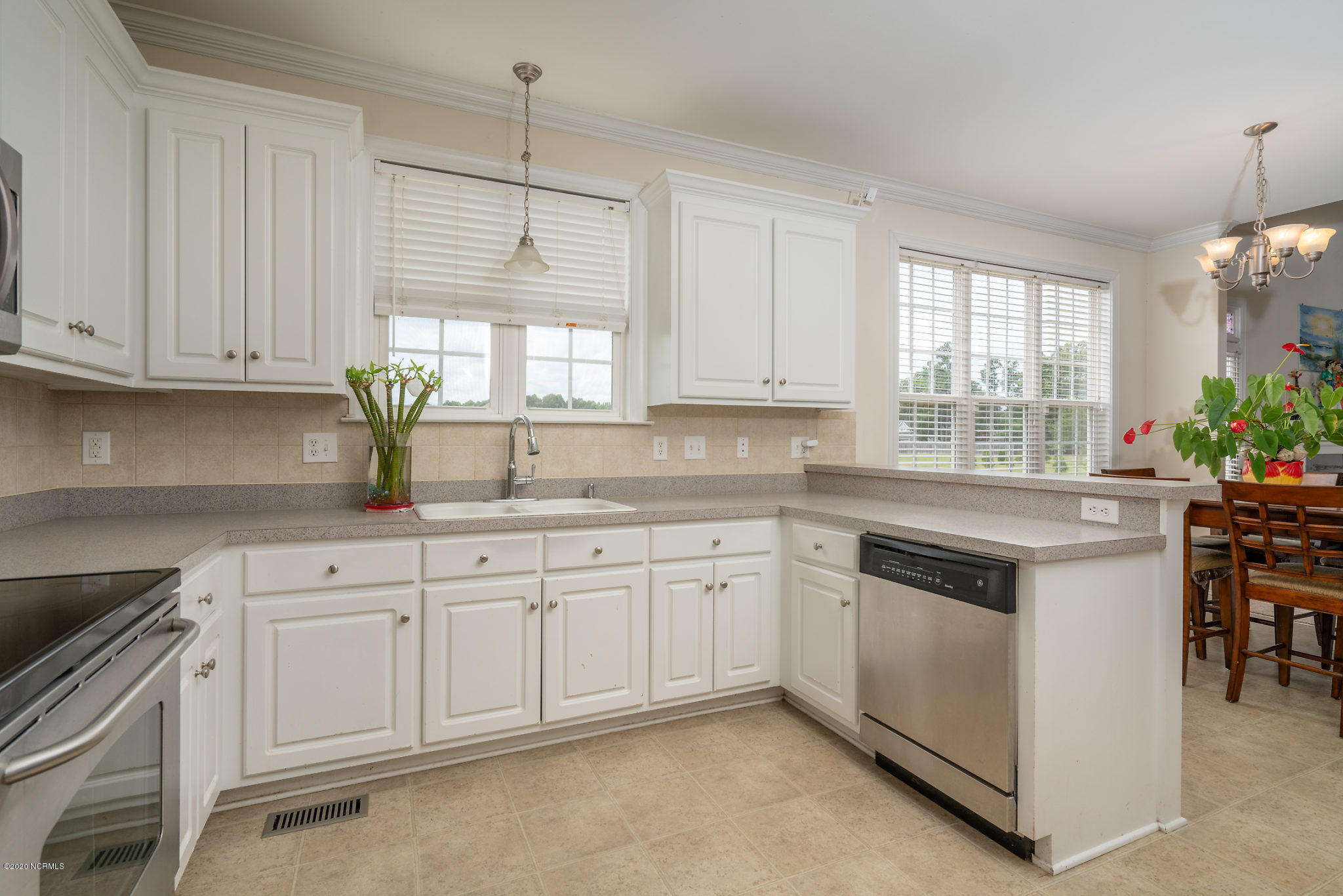 5959 Sandford Road Wilson, NC 27896 - Photo 13 of 36 Kitchen bar area looking into the kitchen eat in