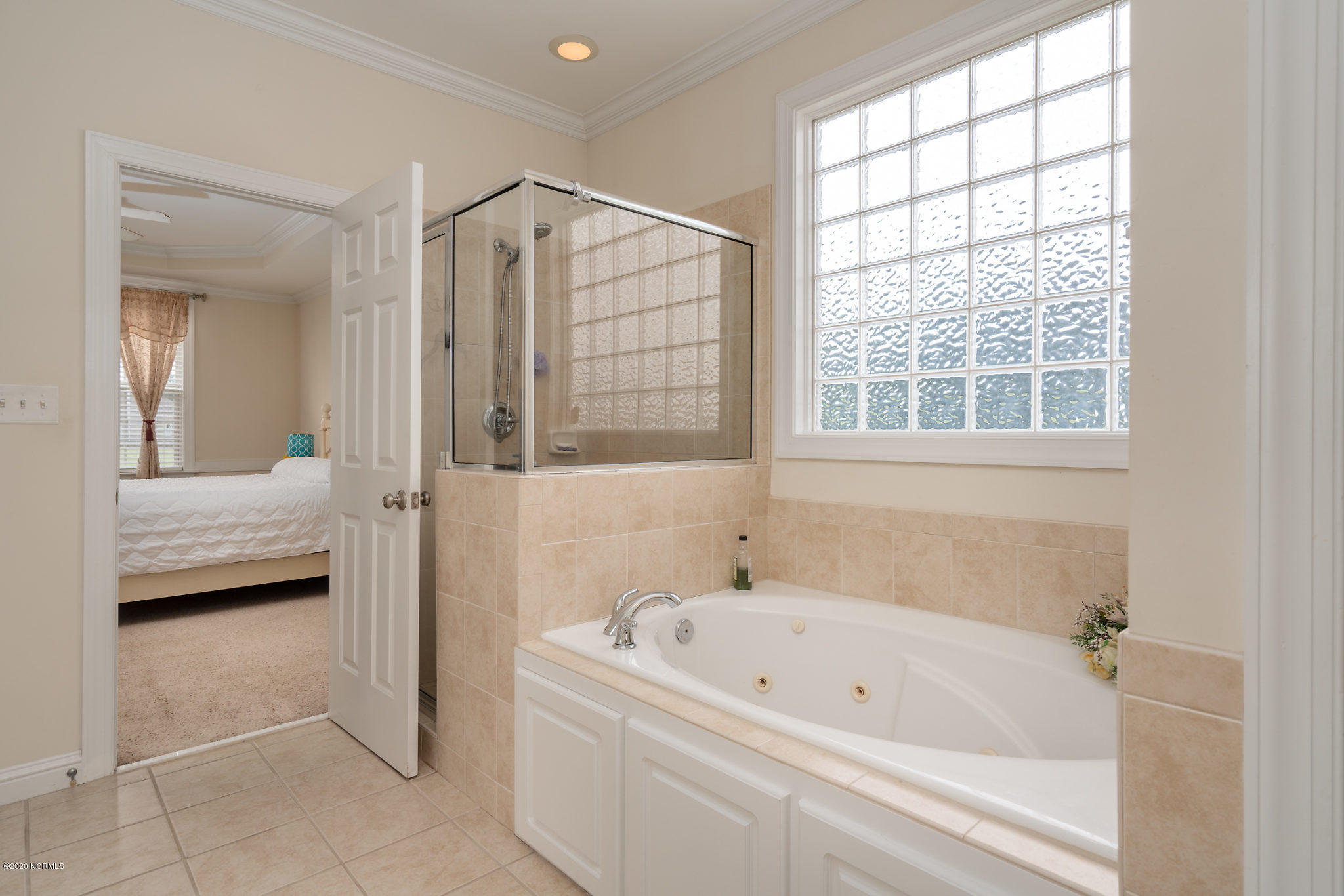 5959 Sandford Road Wilson, NC 27896 - Photo 20 of 36 Master bath has a tiled walk in shower AND a whirlpool bath