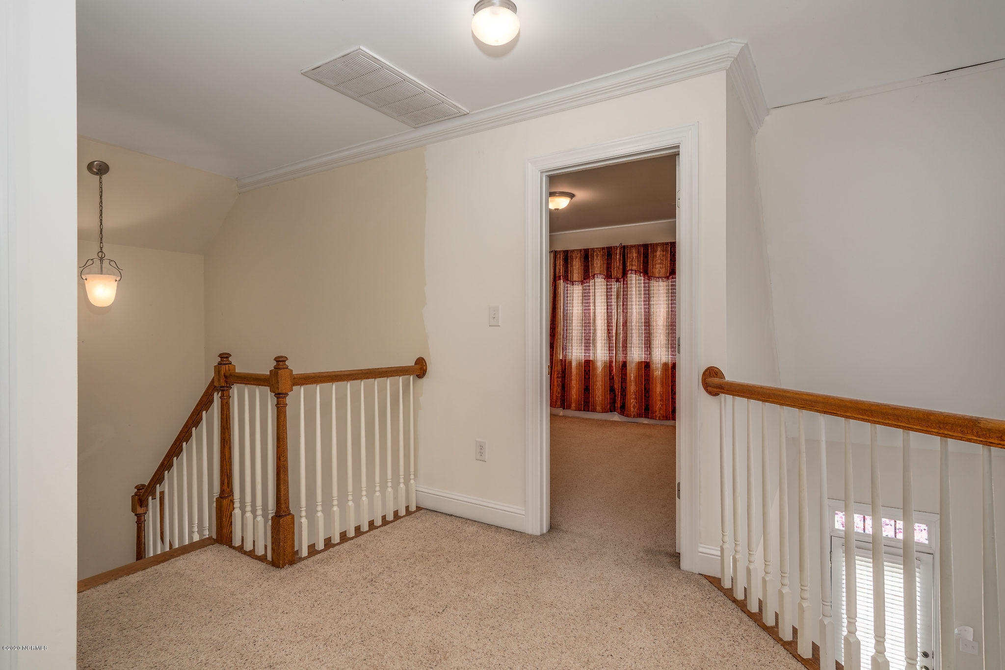 5959 Sandford Road Wilson, NC 27896 - Photo 23 of 36 Landing on 2nd story with overlook to the living room