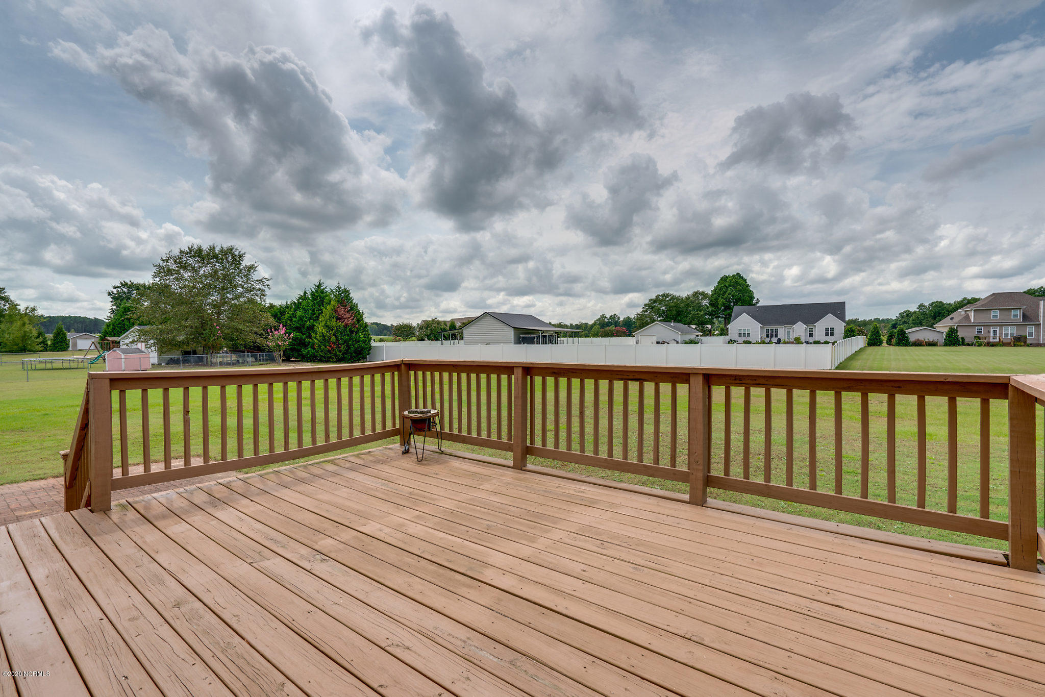 5959 Sandford Road Wilson, NC 27896 - Photo 35 of 36 Wood deck off living room looking at backyard