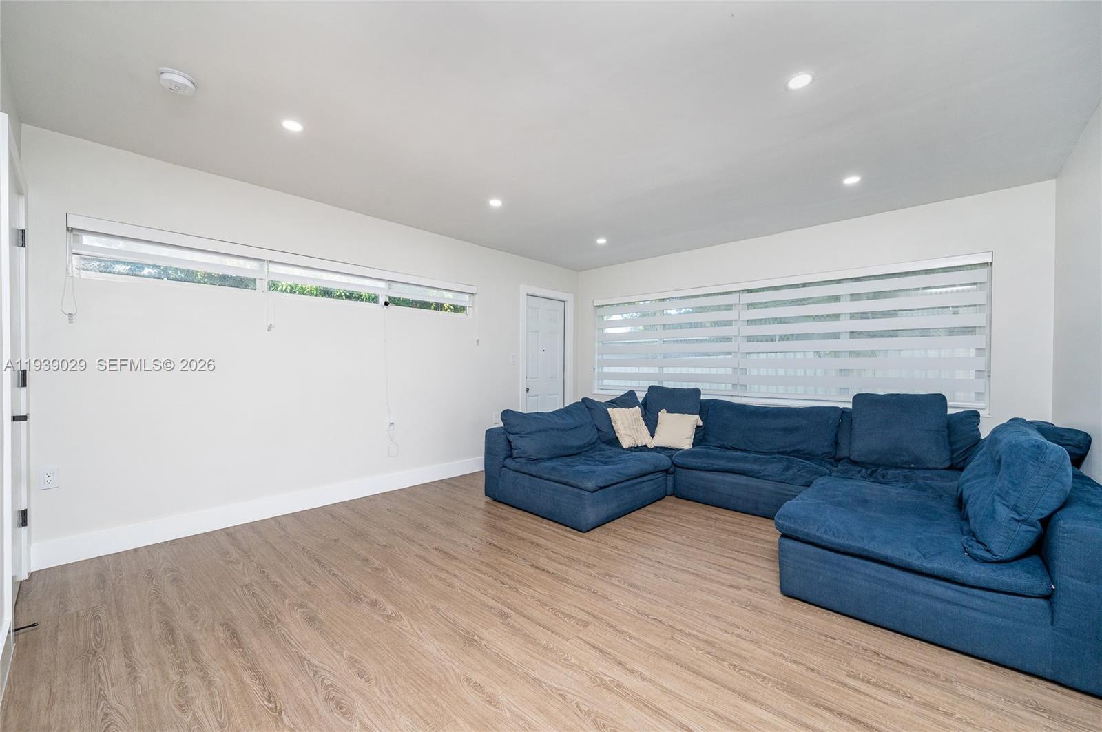 3077 Southwest 5th Street Miami, FL 33135 - Photo 15 of 25 a living room with furniture and a wooden floor