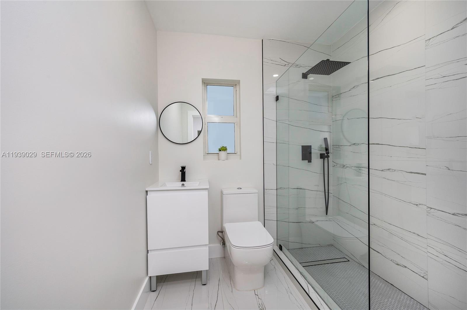 3077 Southwest 5th Street Miami, FL 33135 - Photo 23 of 25 a bathroom with a toilet a sink and shower
