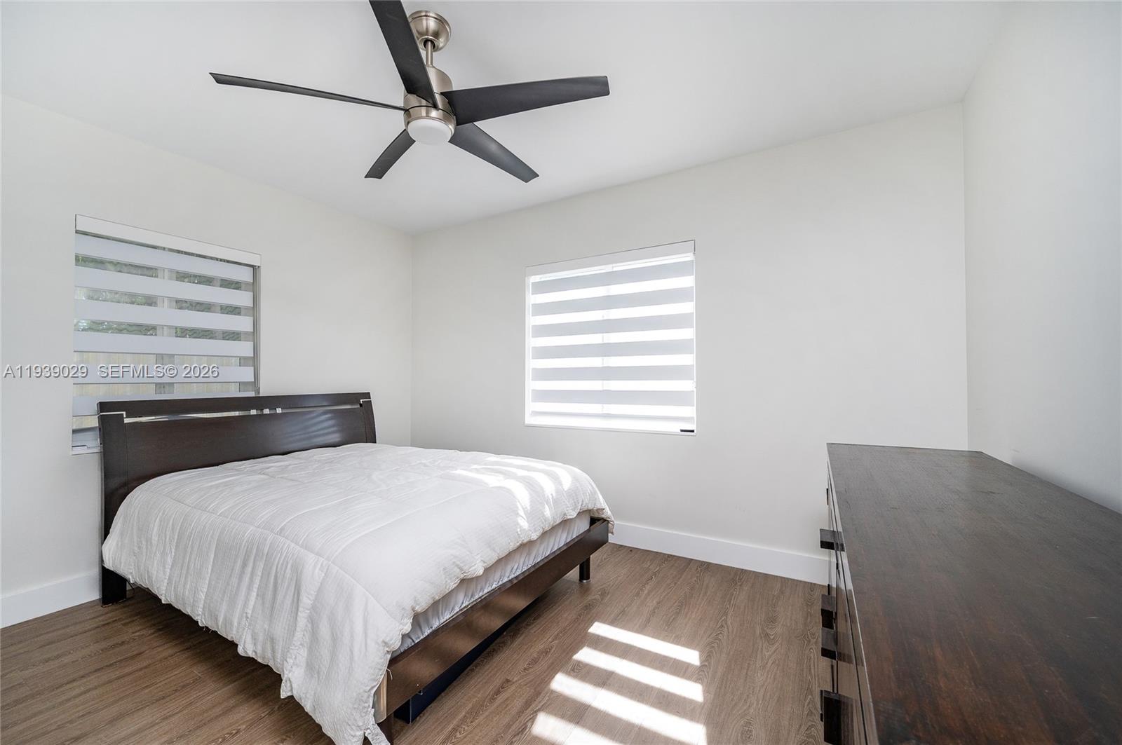 3077 Southwest 5th Street Miami, FL 33135 - Photo 24 of 25 a bedroom with a bed and a window