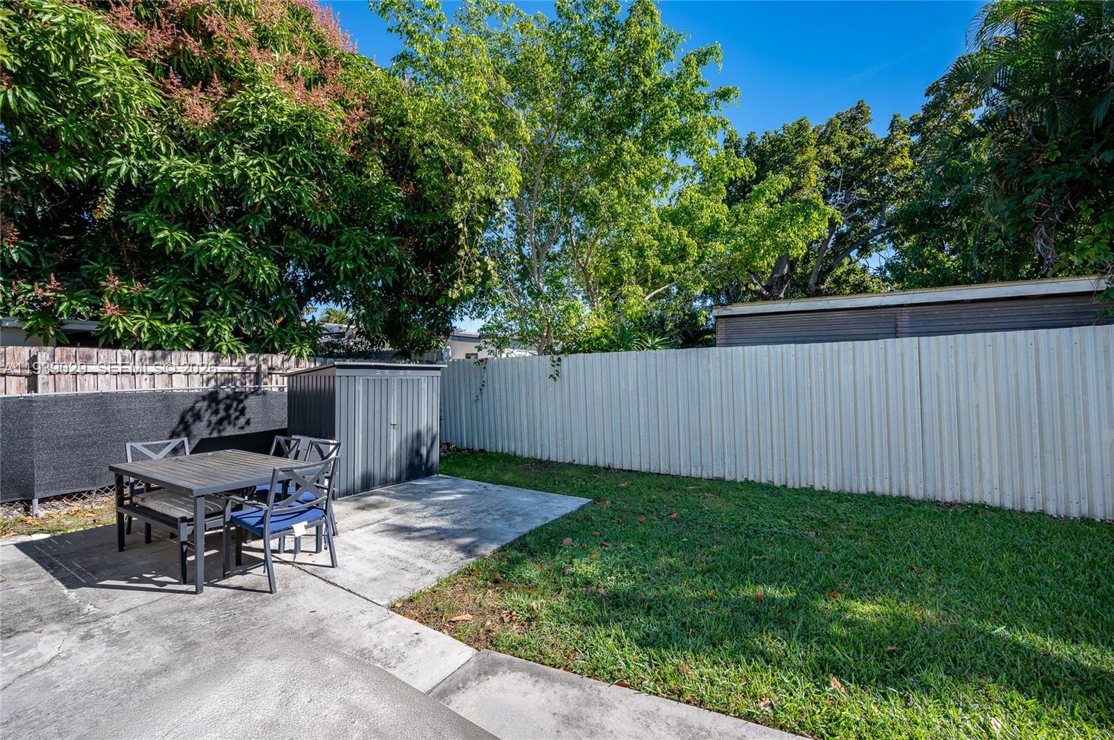 3077 Southwest 5th Street Miami, FL 33135 - Photo 4 of 25 a view of a backyard with a small cabin and chair