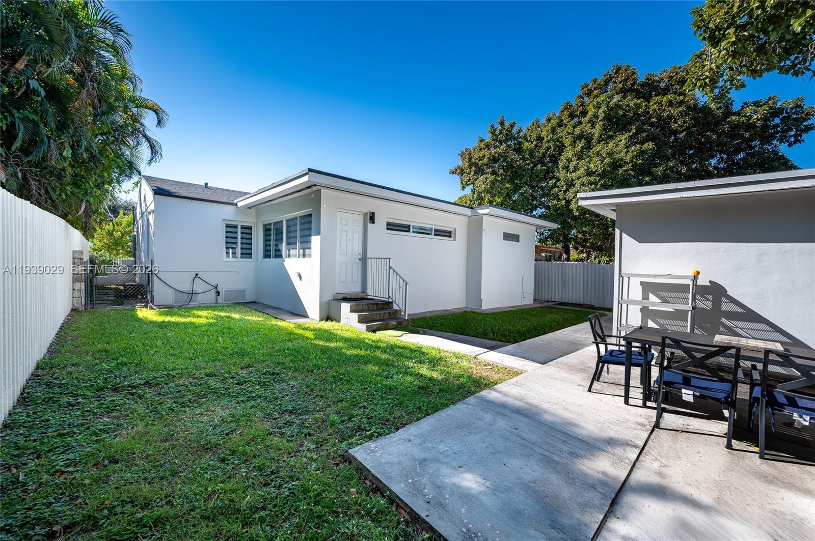 3077 Southwest 5th Street Miami, FL 33135 - Photo 5 of 25 a view of a house with backyard and a patio
