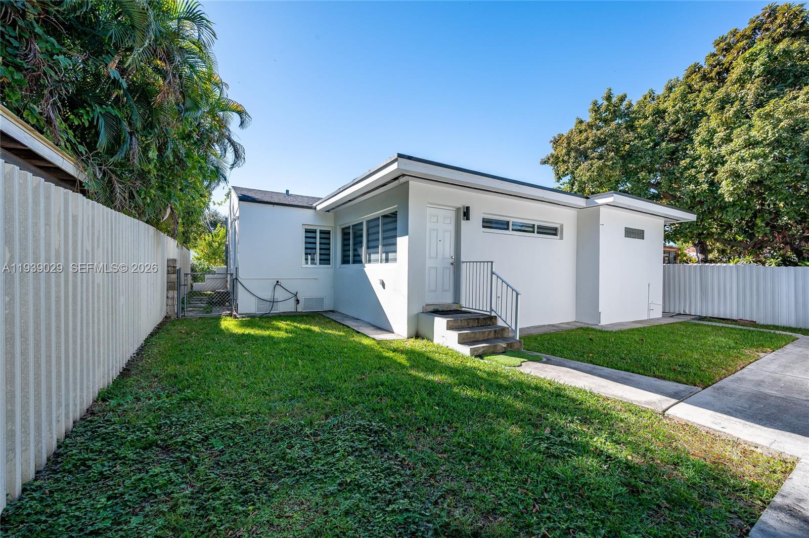 3077 Southwest 5th Street Miami, FL 33135 - Photo 6 of 25 a front view of house with yard and green space