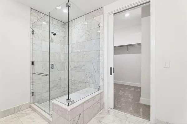 a bathroom with a shower and toilet