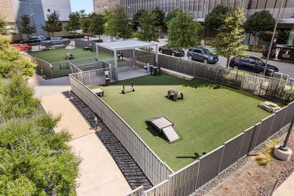 an aerial view of a house with a swimming pool and outdoor seating