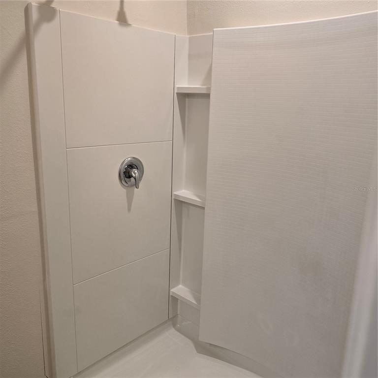 814 Sun Burst Road Winter Haven, FL 33880 - Photo 28 of 48 a bathroom with a shower