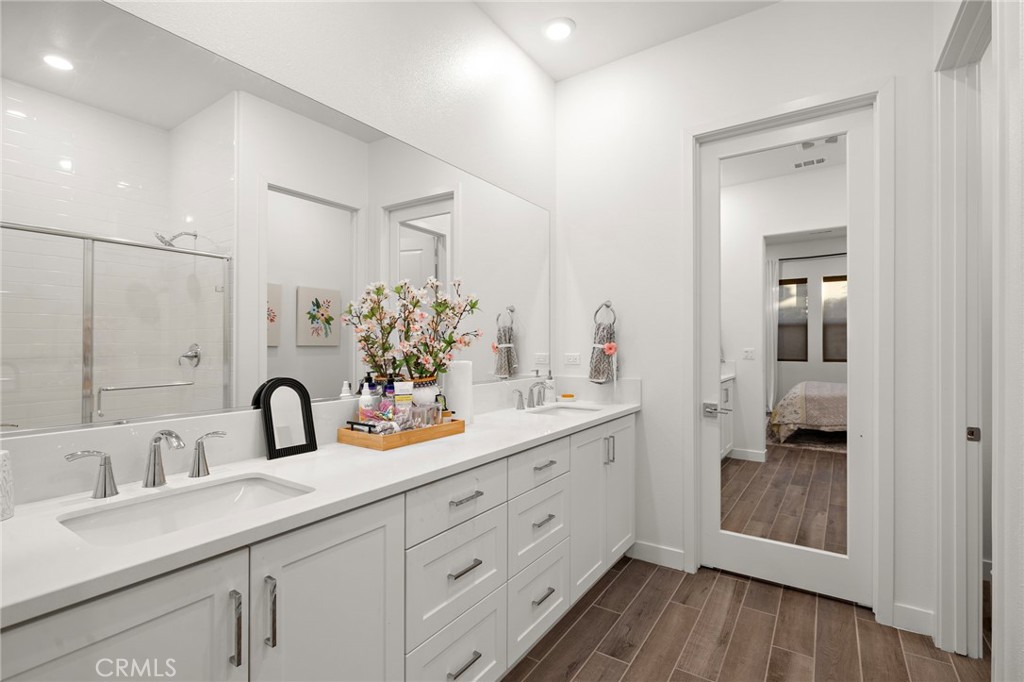 756 Sunrise Road Rancho Mission Viejo, CA 92694 - Photo 12 of 32 a bathroom with a double vanity sink and mirror