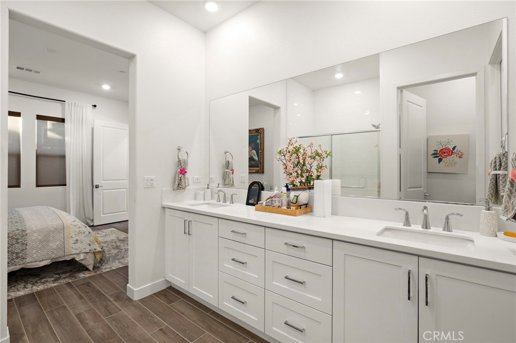 756 Sunrise Road Rancho Mission Viejo, CA 92694 - Photo 13 of 32 a en suite bathroom with double sink and a mirror