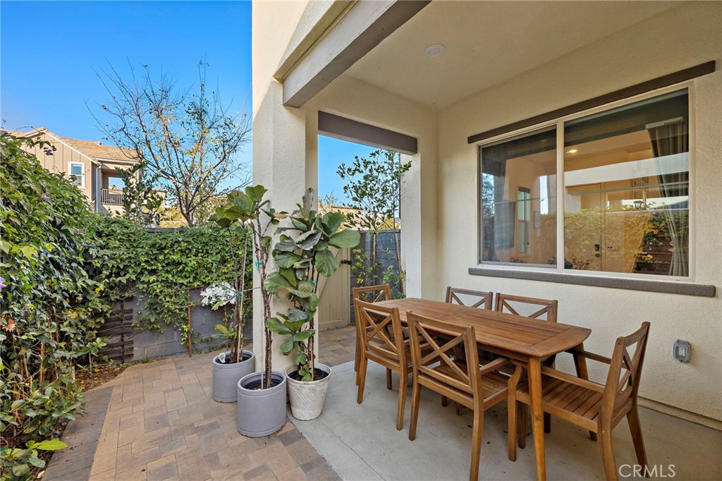 756 Sunrise Road Rancho Mission Viejo, CA 92694 - Photo 15 of 32 a view of an outdoor dining space with a table and chairs