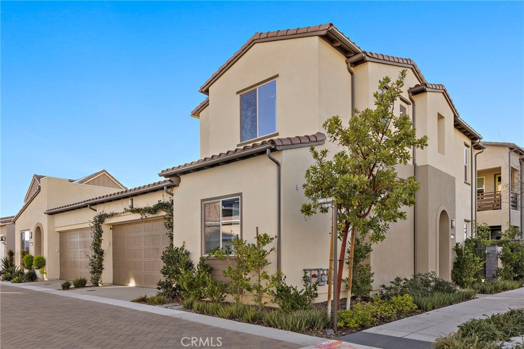 756 Sunrise Road Rancho Mission Viejo, CA 92694 - Photo 2 of 32 a front view of a house with a yard