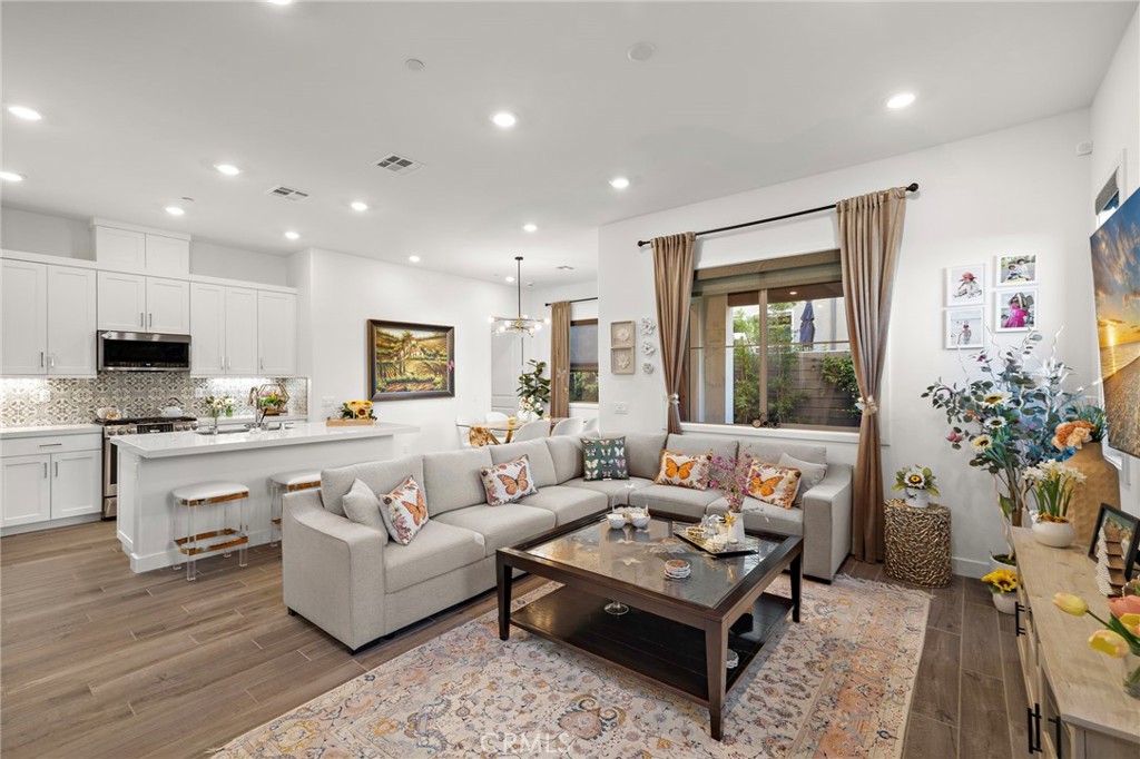 756 Sunrise Road Rancho Mission Viejo, CA 92694 - Photo 7 of 32 a living room with furniture and a large window