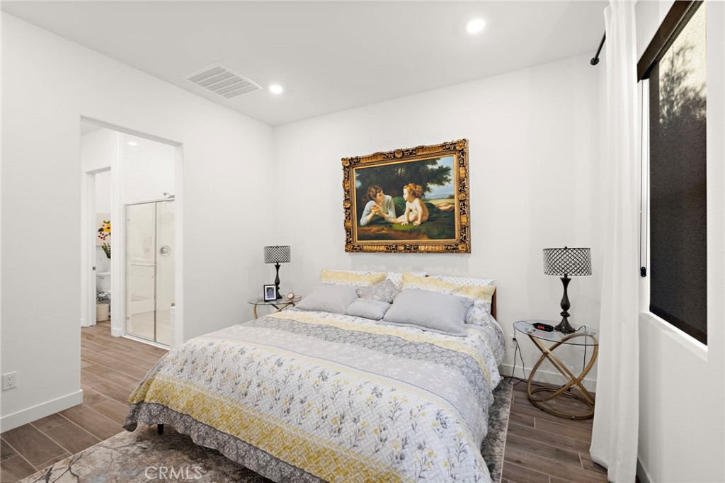756 Sunrise Road Rancho Mission Viejo, CA 92694 - Photo 10 of 32 a bedroom with a bed and a painting on the wall