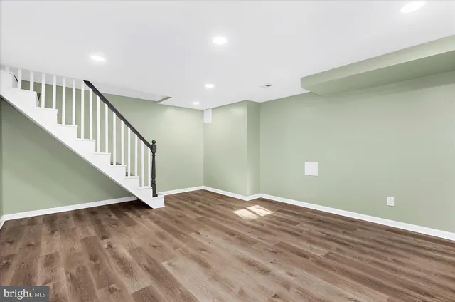 a view of an entryway with wooden floor