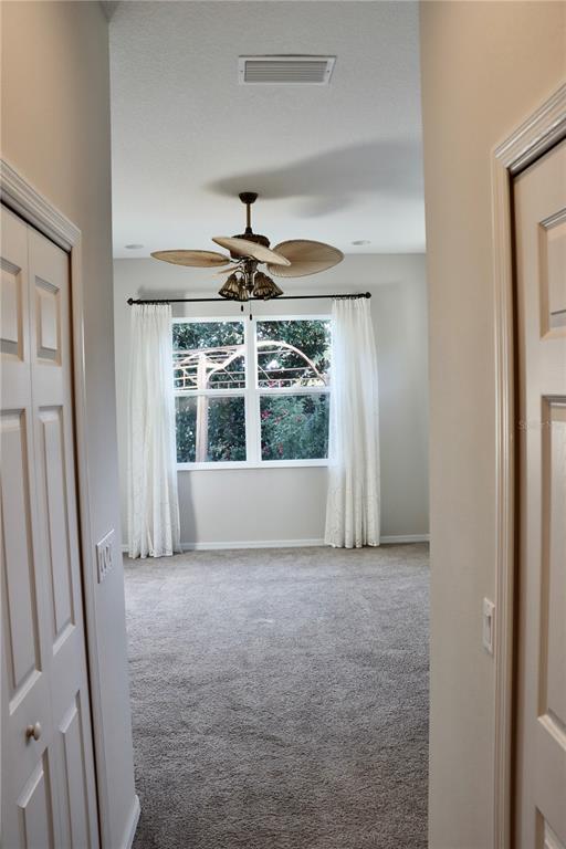 2389 Pawtucket Pass Mount Dora, FL 32757 - Photo 25 of 67 a view of an empty room with a window