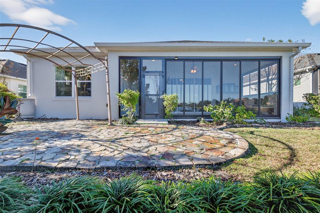 2389 Pawtucket Pass Mount Dora, FL 32757 - Photo 46 of 67 a view of a house with backyard and plants