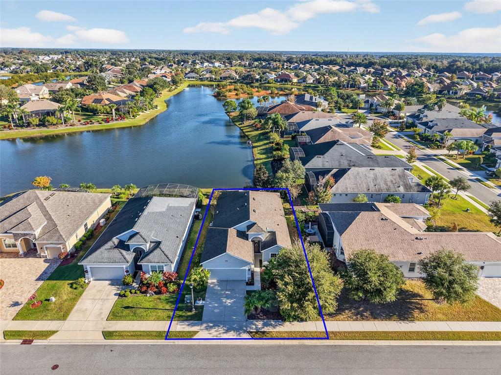 2389 Pawtucket Pass Mount Dora, FL 32757 - Photo 58 of 67 an aerial view of a house with a ocean view