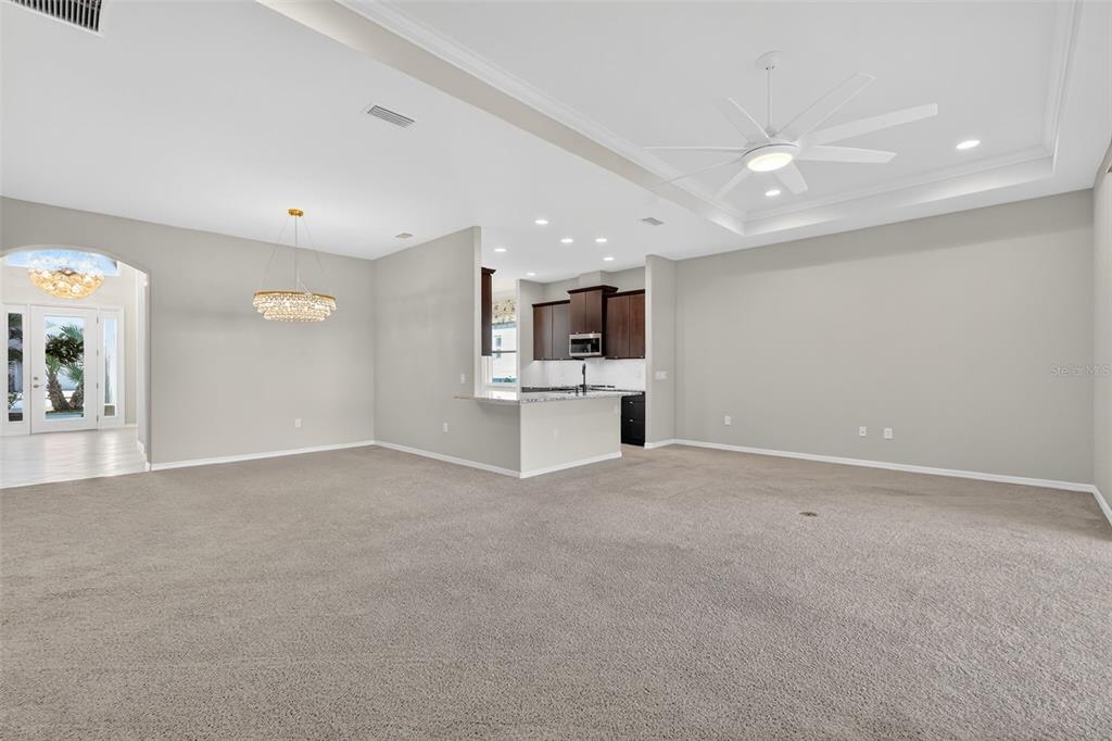2389 Pawtucket Pass Mount Dora, FL 32757 - Photo 9 of 67 a view of a kitchen with a sink and white cabinets