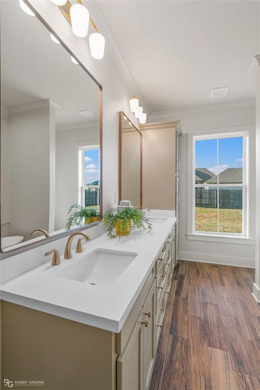 219 Marble Place Haughton, LA 71037 - Photo 18 of 29 Dual vanity with white countertop, undermount sinks, and gold-toned fixtures